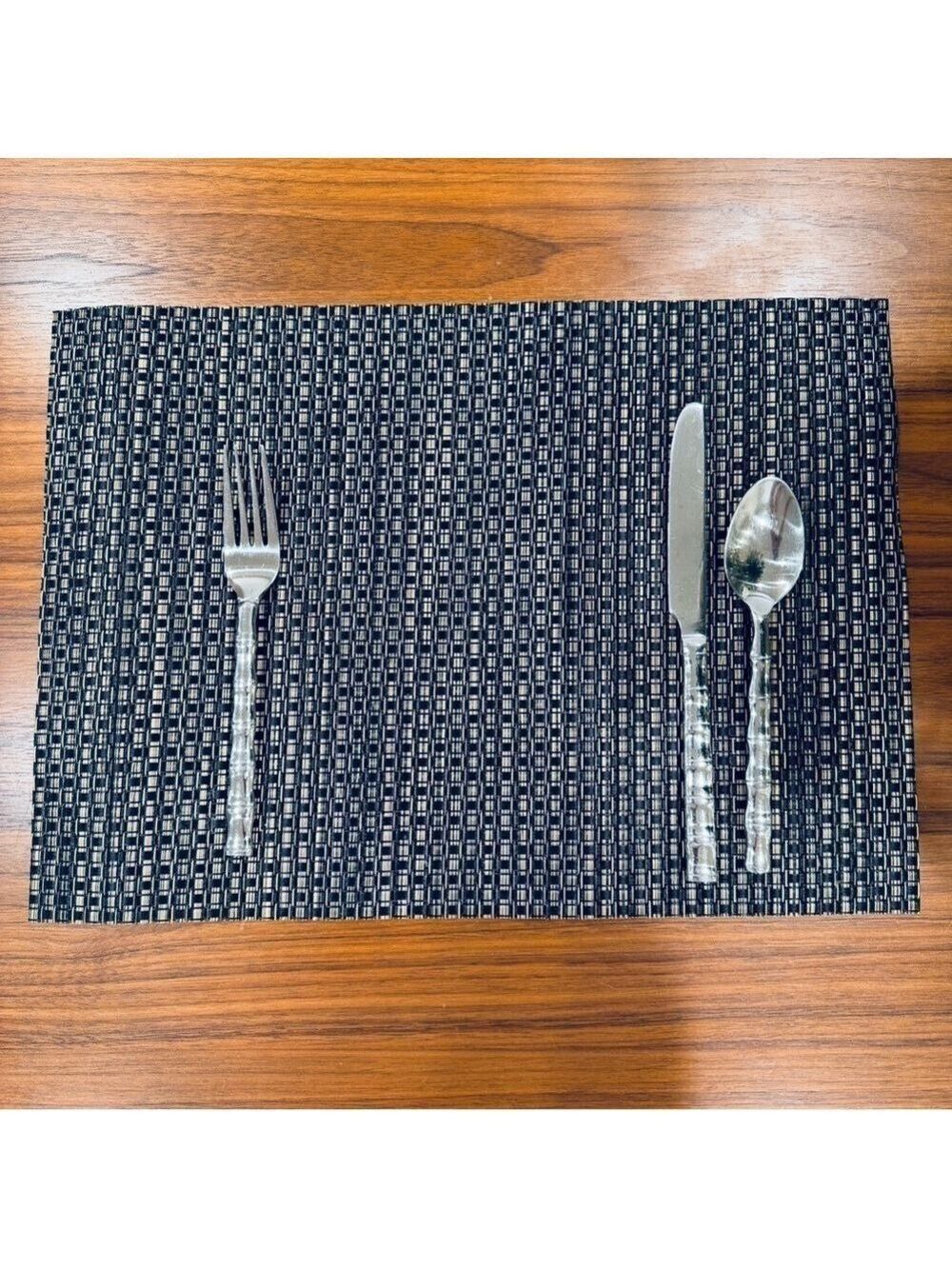 Elegant Black and Silver woven vinyl placemat set.
